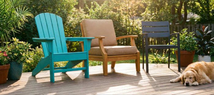 A sunny backyard deck scene with three chairs side by side — a bold-colored HDPE Adirondack, a warm honey-toned teak lounge chair, and a  powder-coated aluminum chair