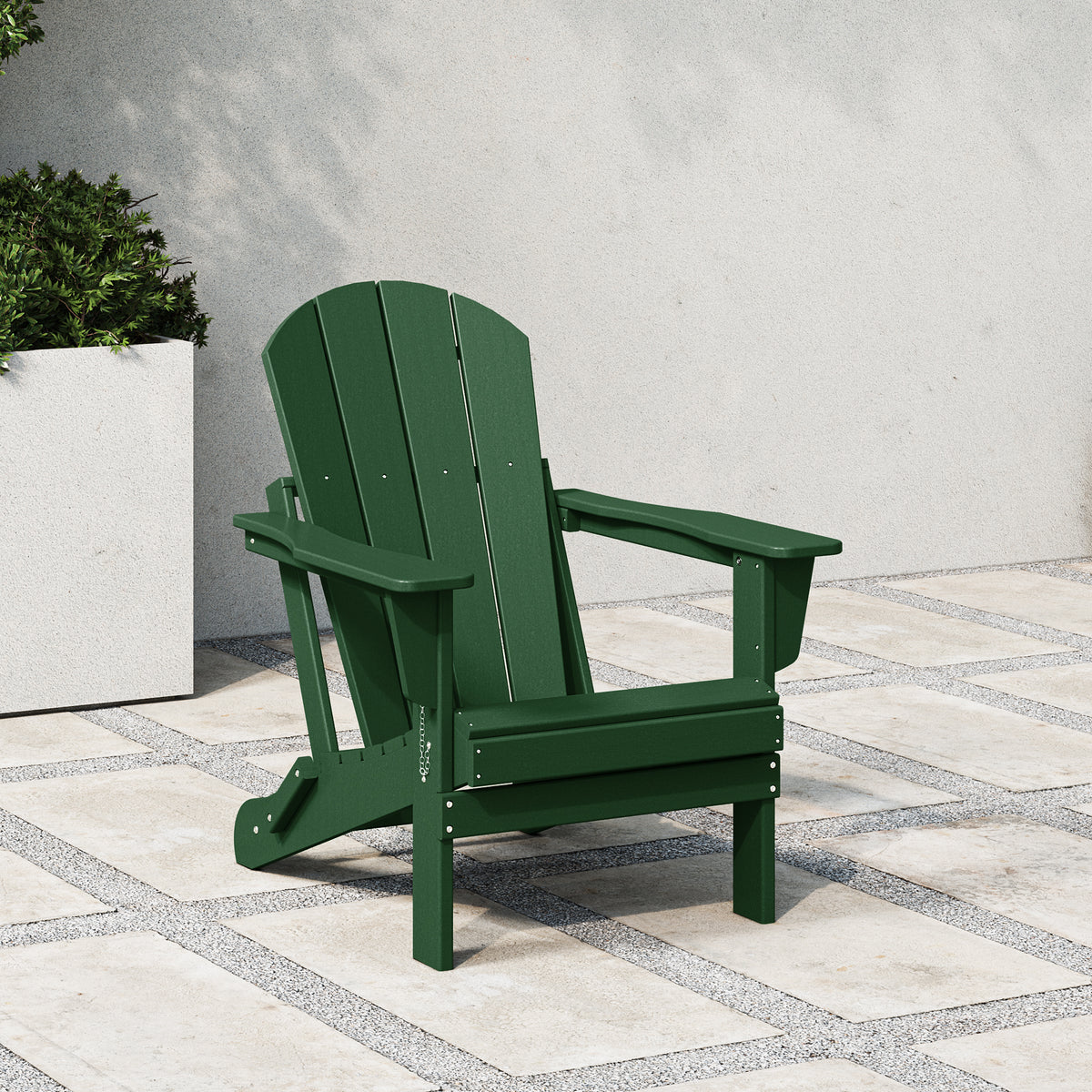 Malibu folding Adirondack chair in Dark Green styled outdoors
