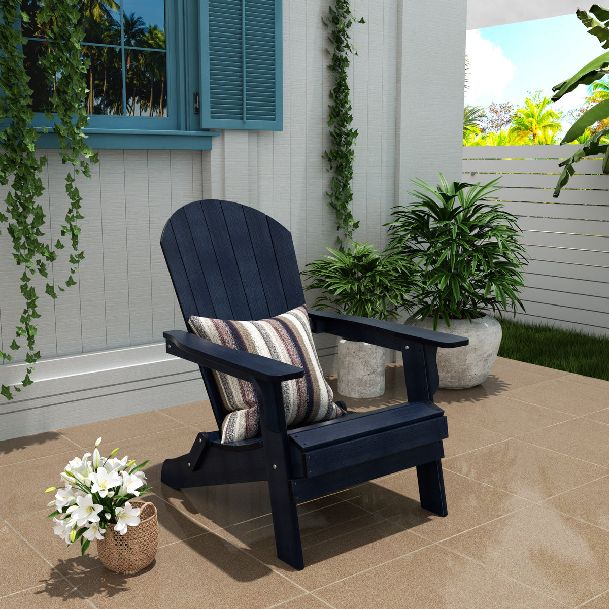 Tuscany folding Adirondack chair in Navy Blue styled outdoors