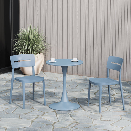 Playa stackable dining chair in French Blue styled outdoors