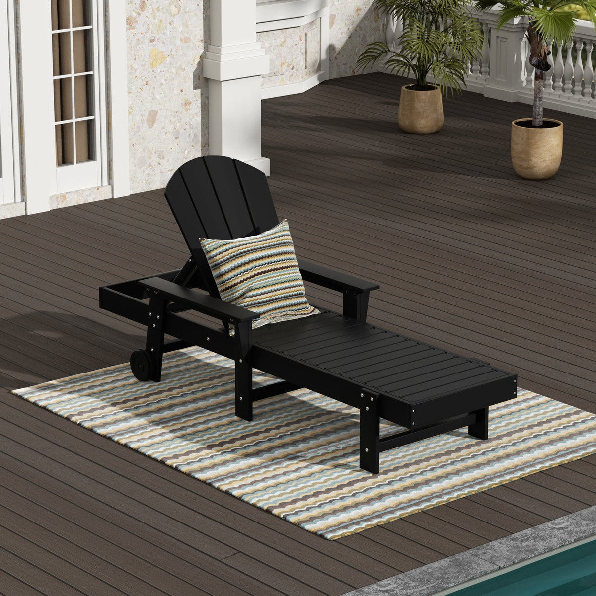 Malibu reclining chaise lounge with arms and wheels in Black styled outdoors