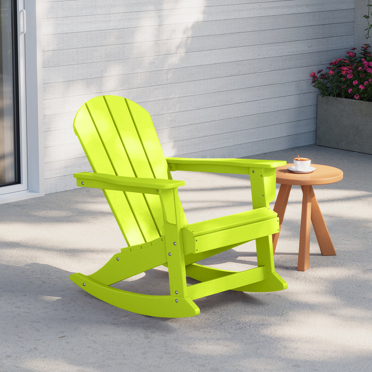 Malibu Adirondack rocking chair in Lime styled outdoors