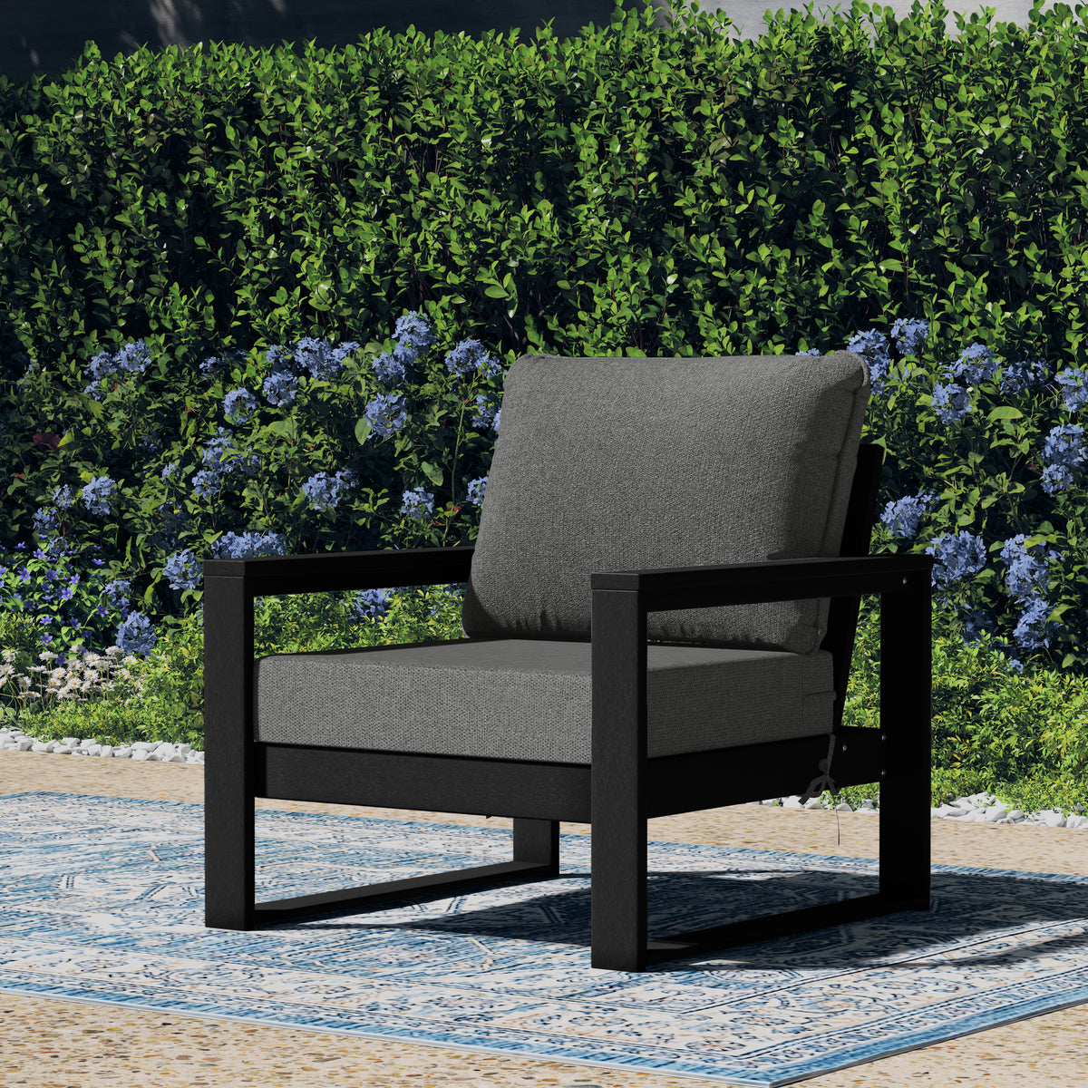 Montara club chair in Black with Gray cushions styled outdoors