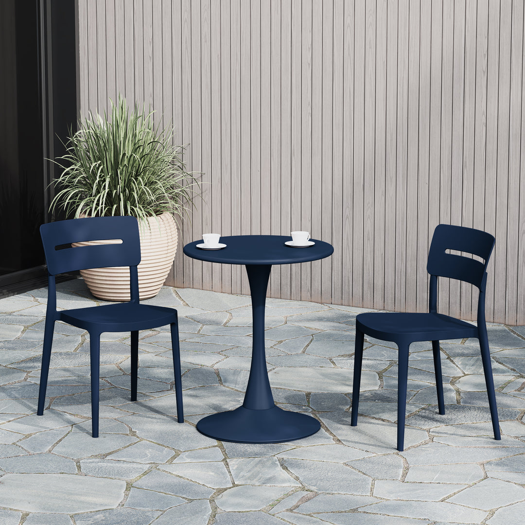 Playa stackable dining chair in Navy Blue styled outdoors