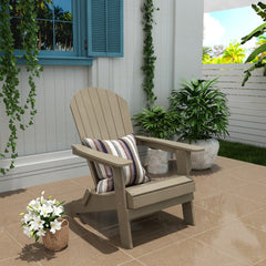Tuscany folding Adirondack chair in Taupe styled outdoors