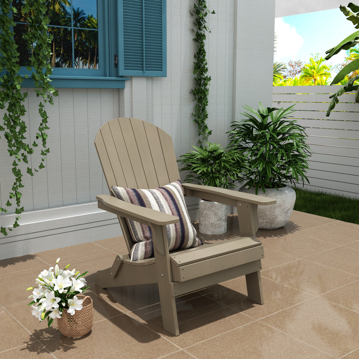 Tuscany folding Adirondack chair in Taupe styled outdoors