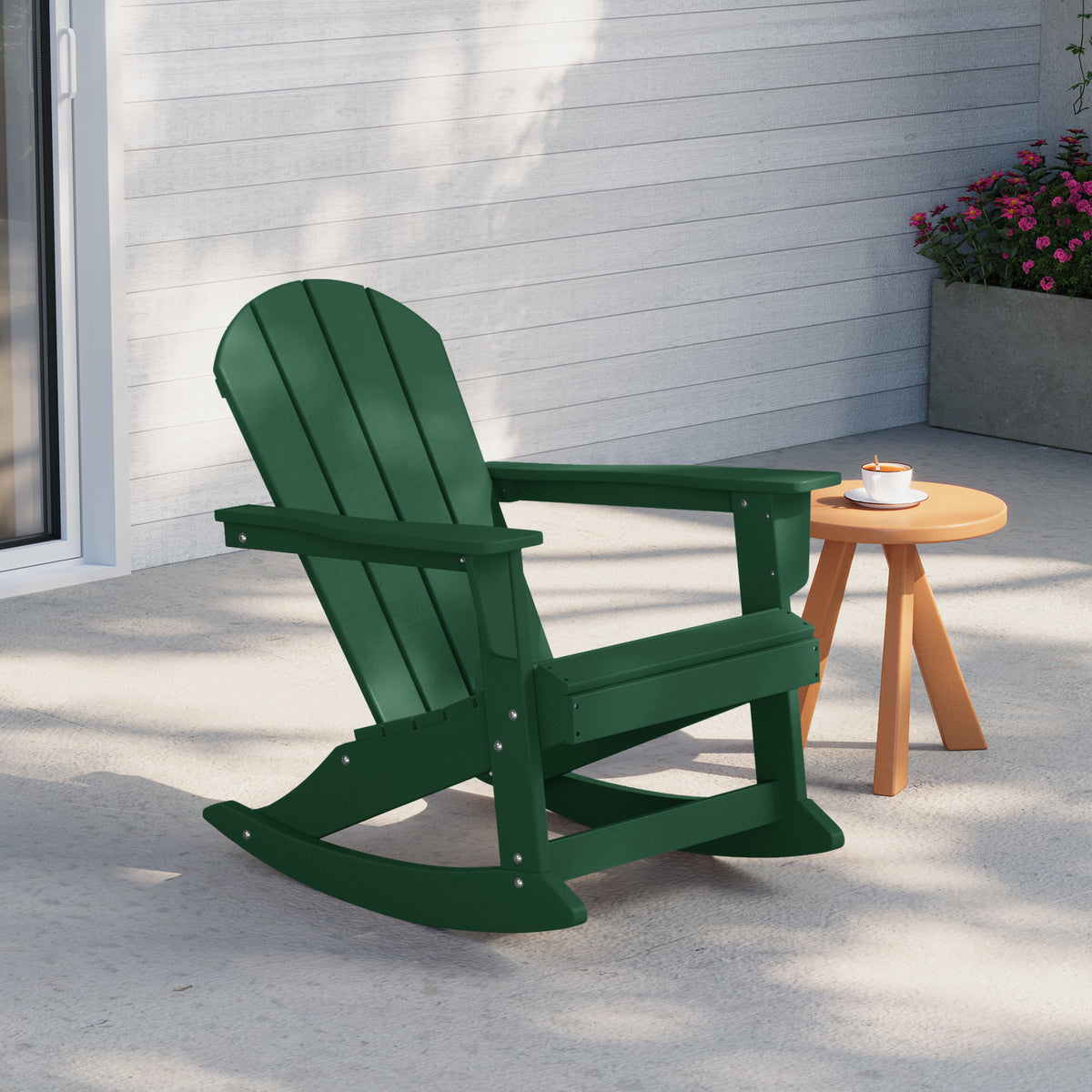 Malibu Adirondack rocking chair in Dark Green styled outdoors