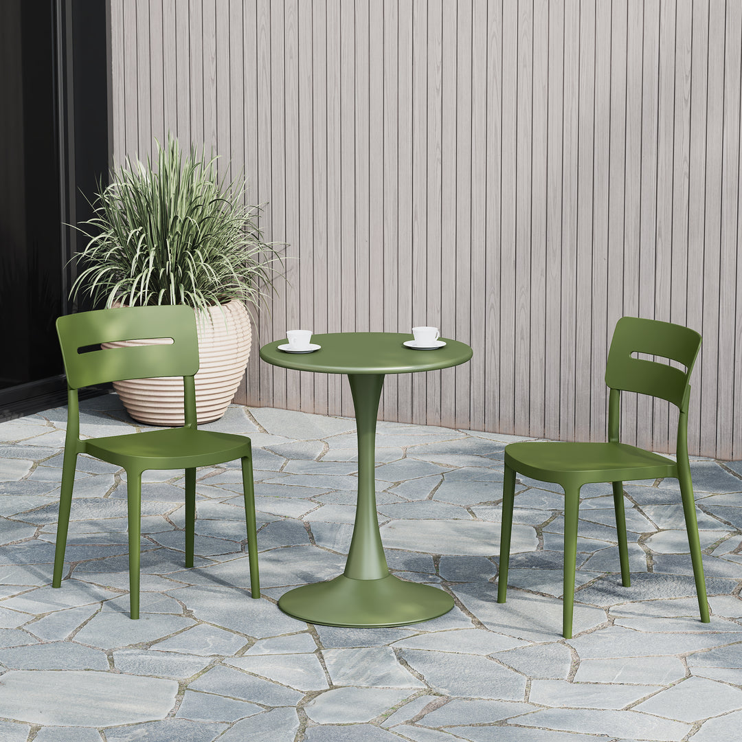Playa stackable dining chairs in Olive Green with a round table on a patio