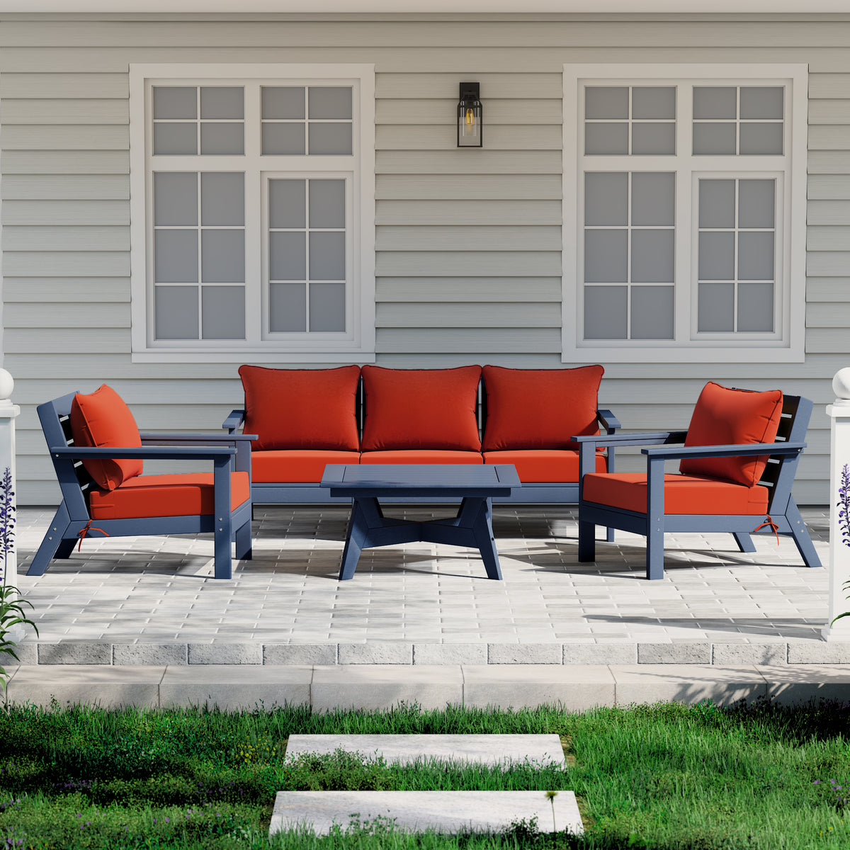 Avalon 6 piece modular sectional sofa set in Navy Blue with Orange cushions styled outdoors