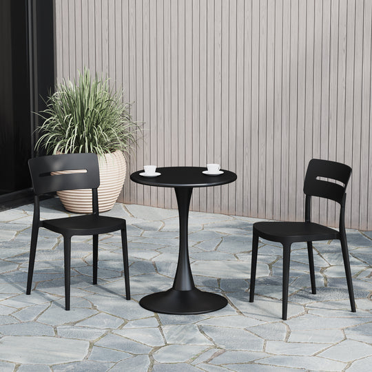 Playa round dining table set in Black styled outdoors