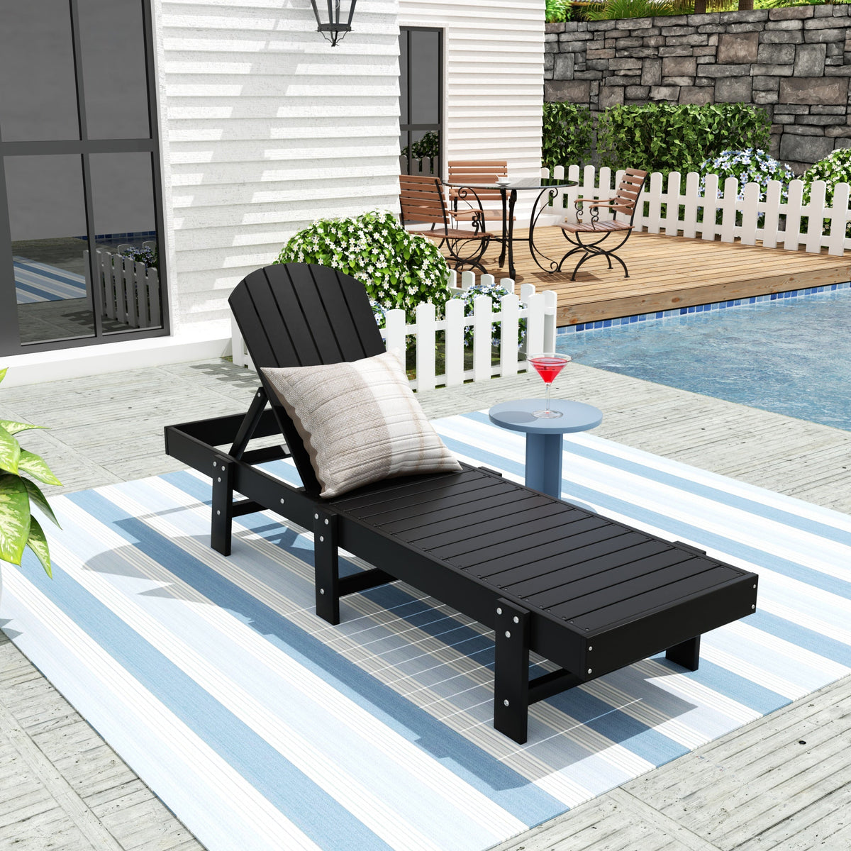 Dylan Adirondack reclining chaise lounge in Black styled outdoors