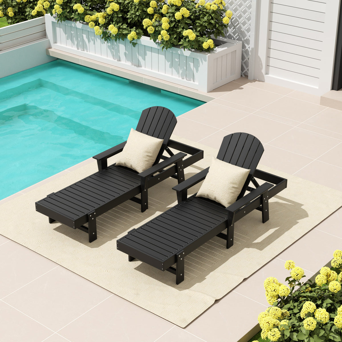 Dylan Adirondack reclining chaise lounge with arms in Black styled outdoors